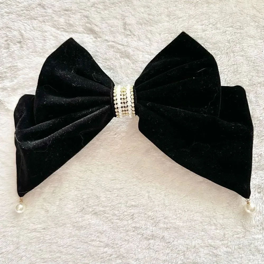 Black velvet bow with faux pear and rhinestone accents
